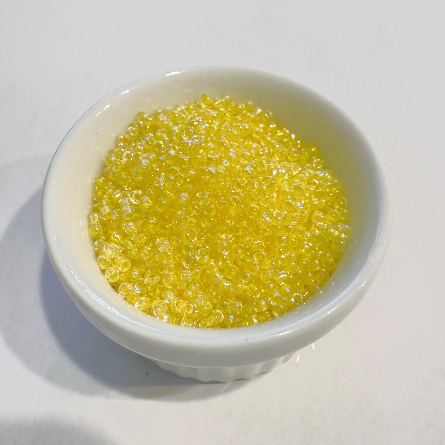 Dyna-Mites™ 11/0 Round Hole Yellow Lined Crystal Rainbow 1848SB Seed Beads - 5 gm