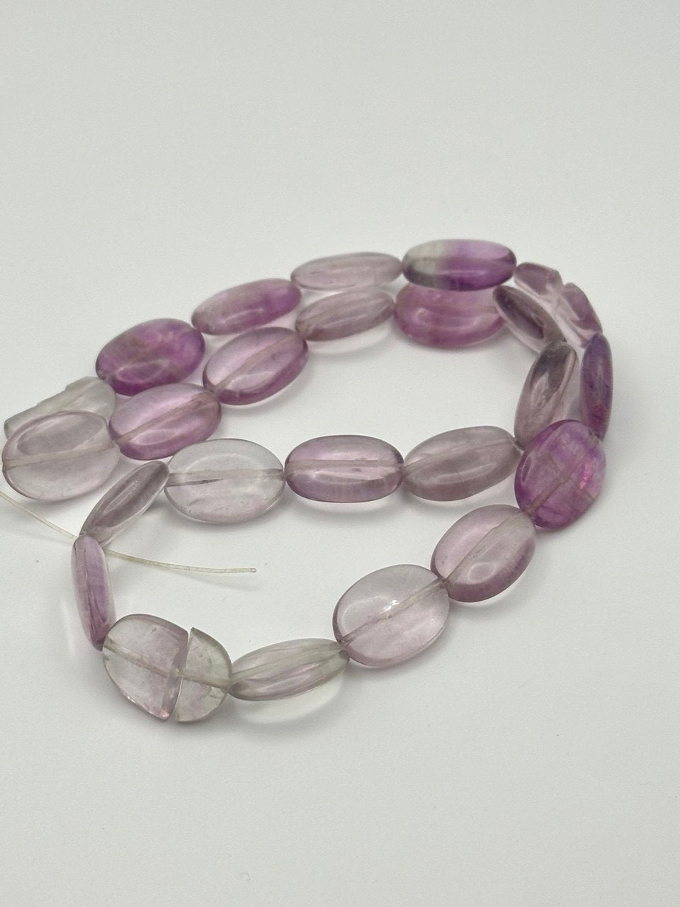 Amethyst clear to purple colored beads