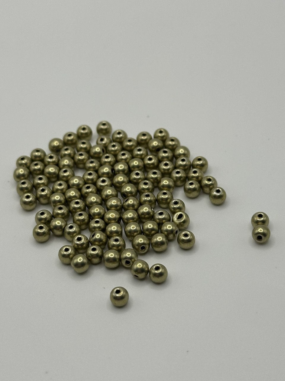 Bronze beads on a white background