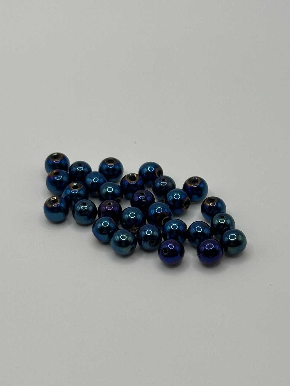 Blue beads on a light gray background