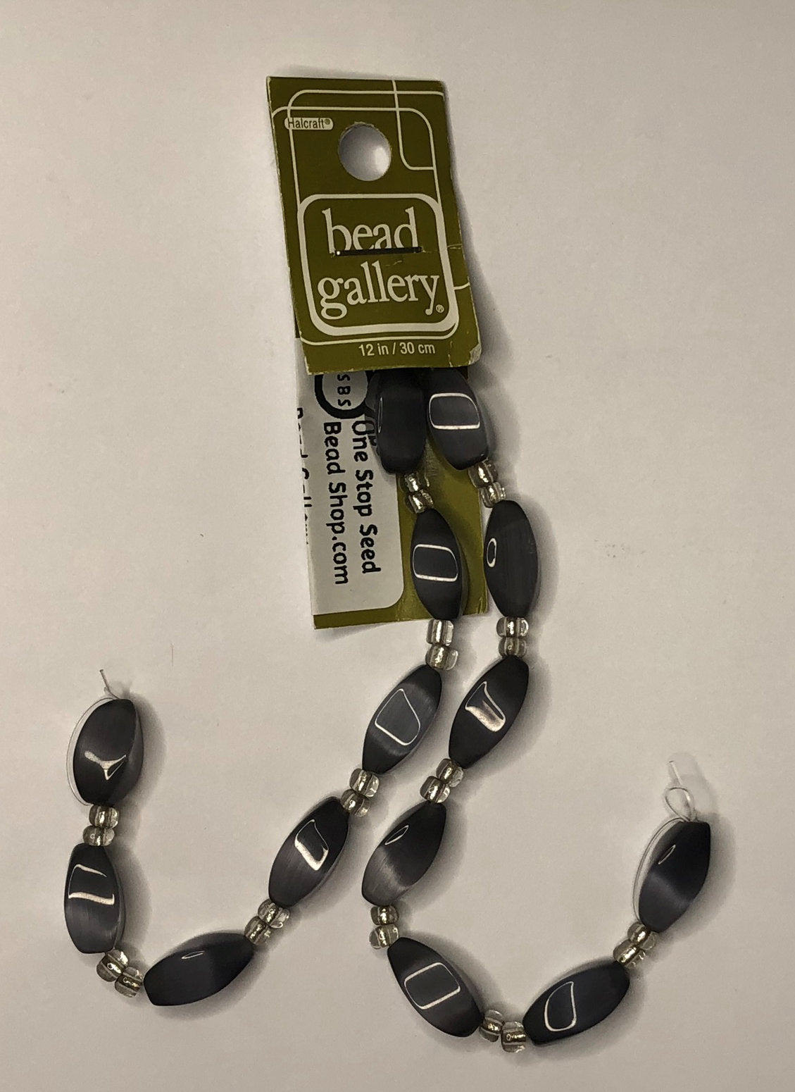 Galerie korálků Jet Grey Cat's Eye Twisted Rectangle Skleněné korálky, 8 x 16 mm - 14 korálků