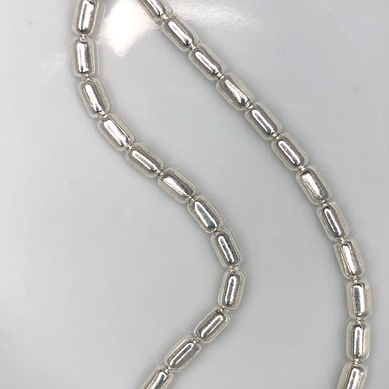 Perles en métal plaqué argent, 5 x 3 mm - 38 perles