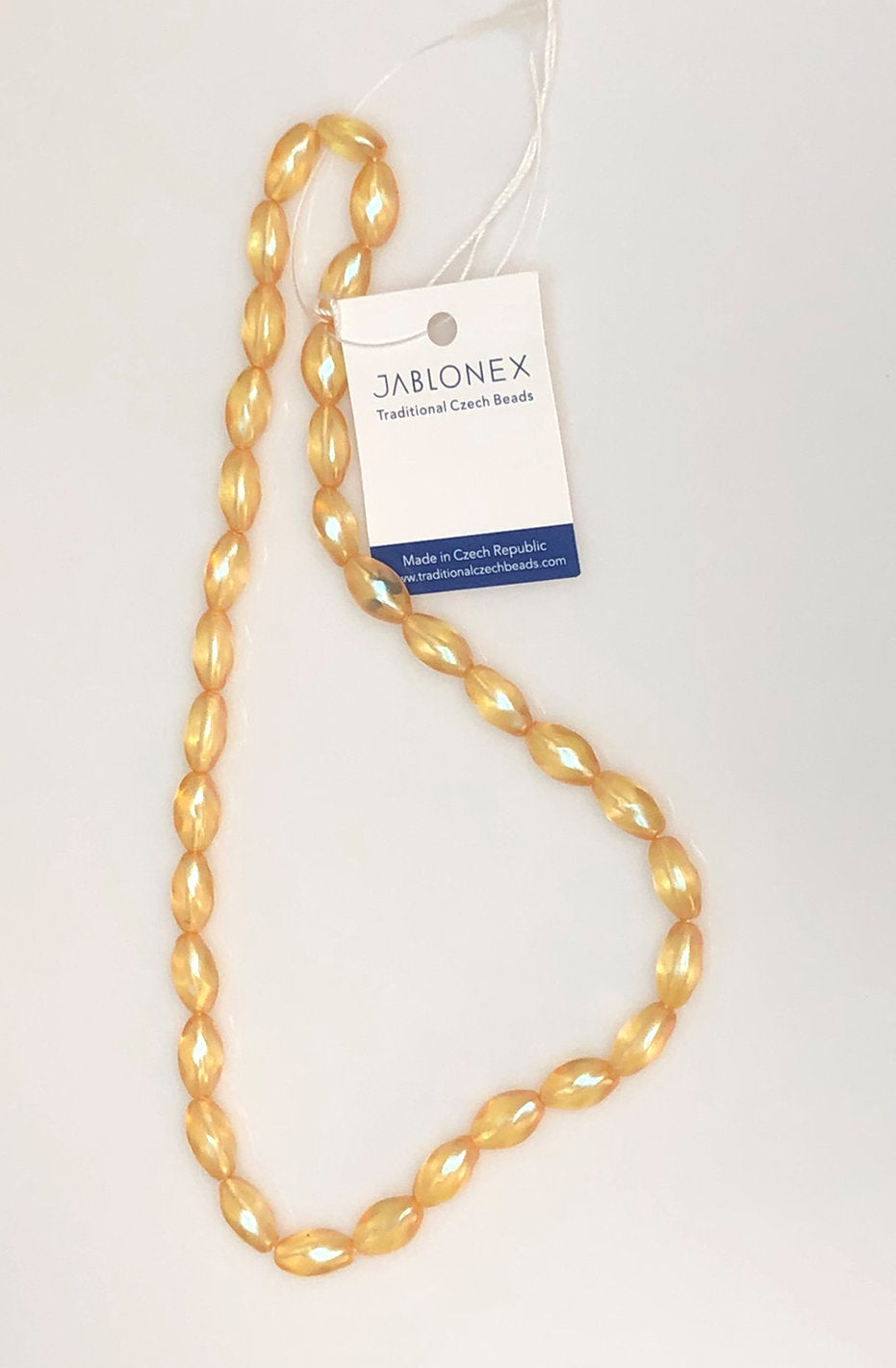 Preciosa Czech 00030-79246 Perles de verre pressé ovales torsadées semi-lustrées pêche transparentes, 12 x 7 mm - 33 perles