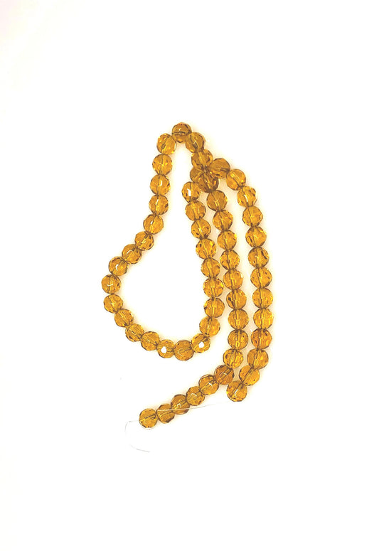 Transparentní topaz / hnědé kulaté skleněné korálky s fazetou, 6 mm – 15palcový pramen