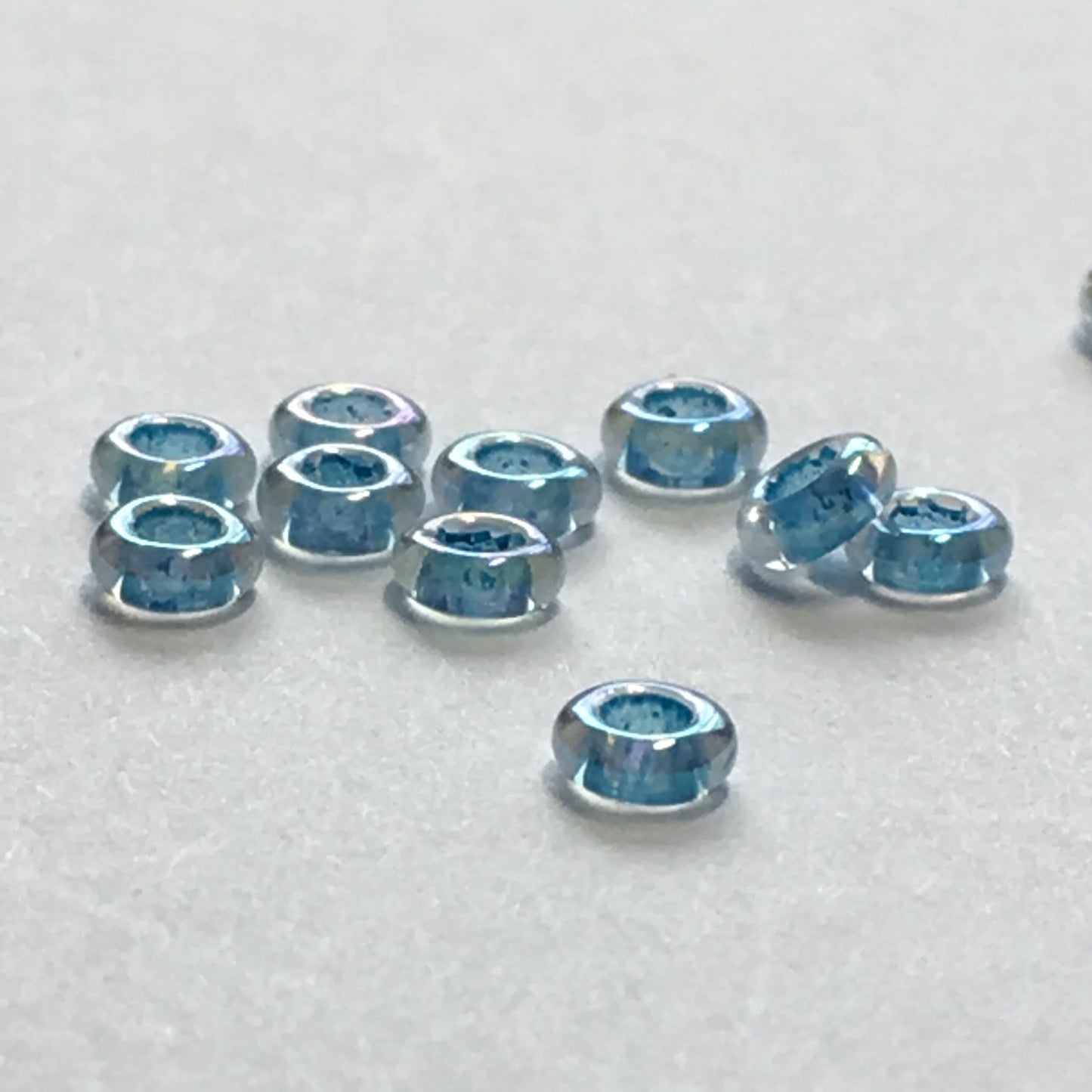 TOHO TD-8-781 - 8/0 Dark Aqua Lined Crystal Rainbow Demi Beads, 5 gm