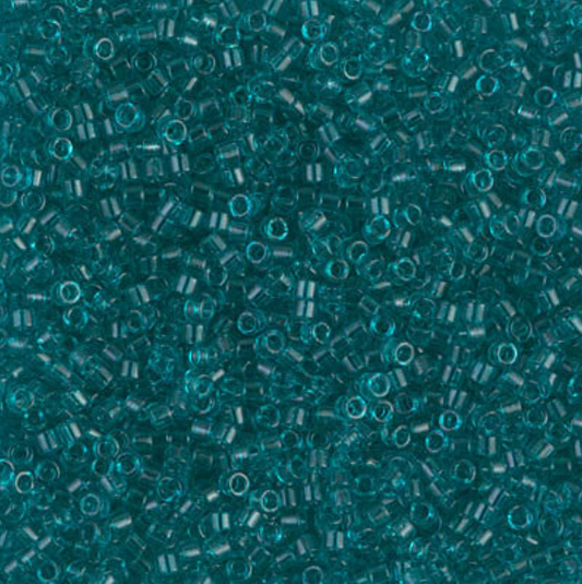 a pile of transparent caribbean teal seed beads