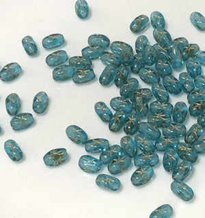 Czech 10390-60010 Aqua Blue with Star Glass Rice Beads, 6 x 4 mm - 50 Beads