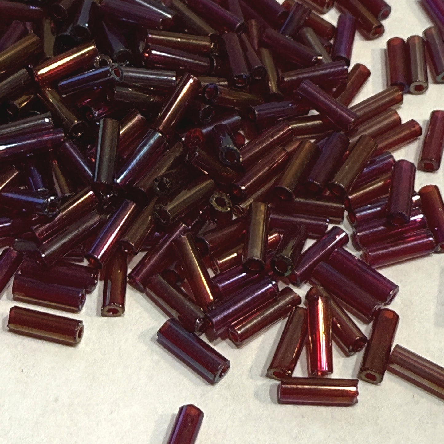 Preciosa #3 - 6-7 mm 91120 Transparent Garnet Rainbow Glass Bugle Beads - 5 gm