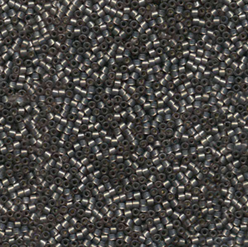 Close-up of small metallic beads arranged in a pattern