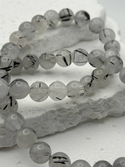 Quartz beads on white surface