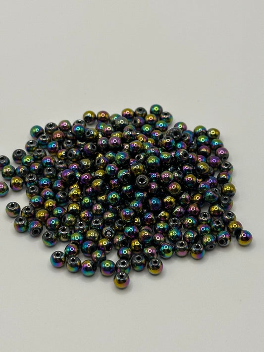 Multicolored hematite beads on a light gray background
