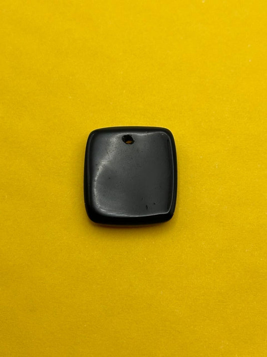 Black square object on a yellow background