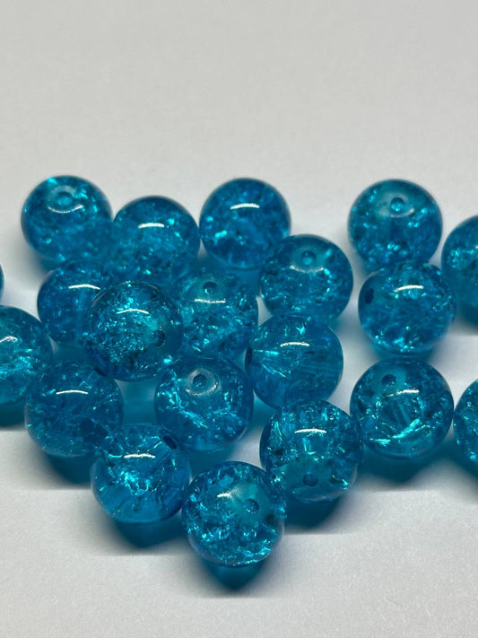 Blue glass beads on a white background