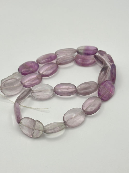 Amethyst clear to purple colored beads