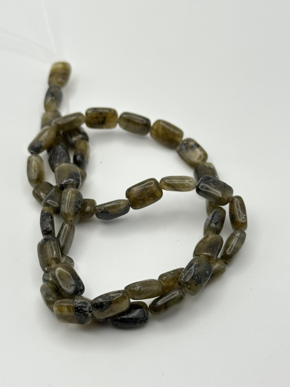 String of brown beads on a white background