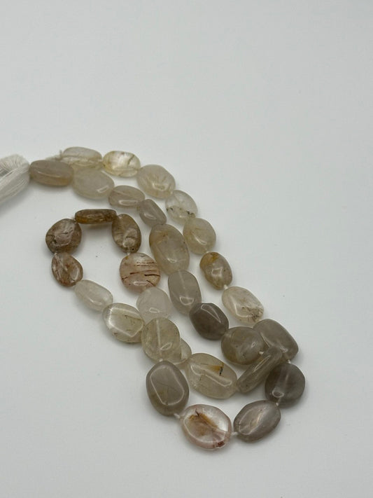 String of brown and beige beads on a white background