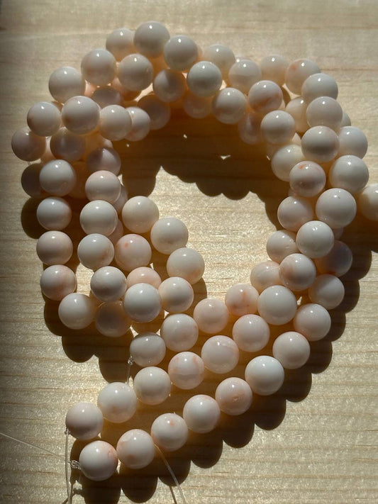Botswana agate beads on wooden surface