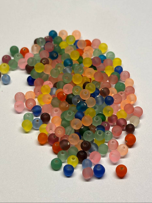 Colorful glass beads on a white background