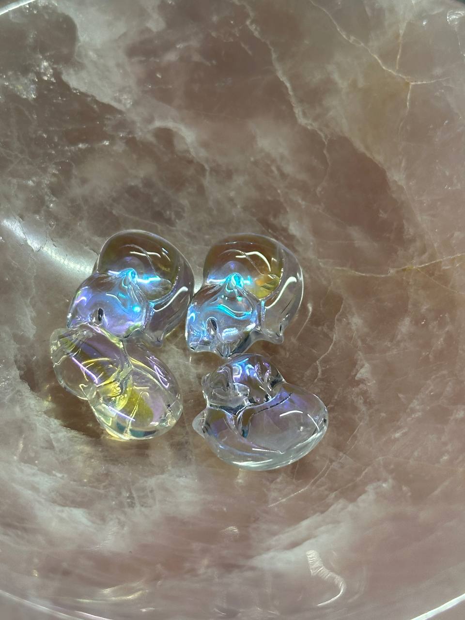 Clear fox-shaped earrings on a marble surface