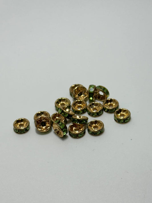 Gold plated brass austrian rondelle spacers with peridot rhinestones