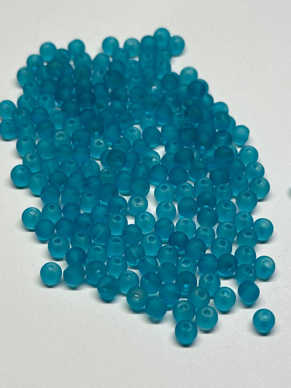 Turquoise beads on a white background