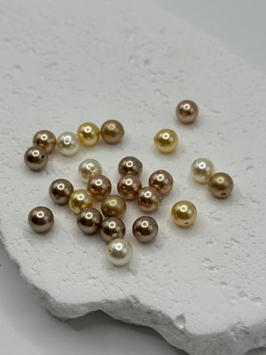 Multicolor crystal pearls on a textured white surface