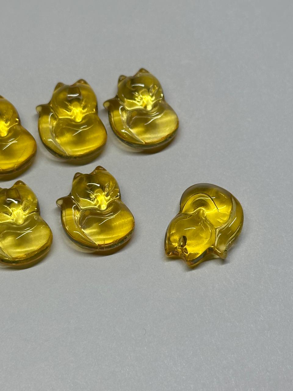 Yellow fox beads on a gray background