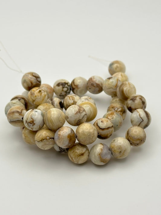 large agate beads on white surface