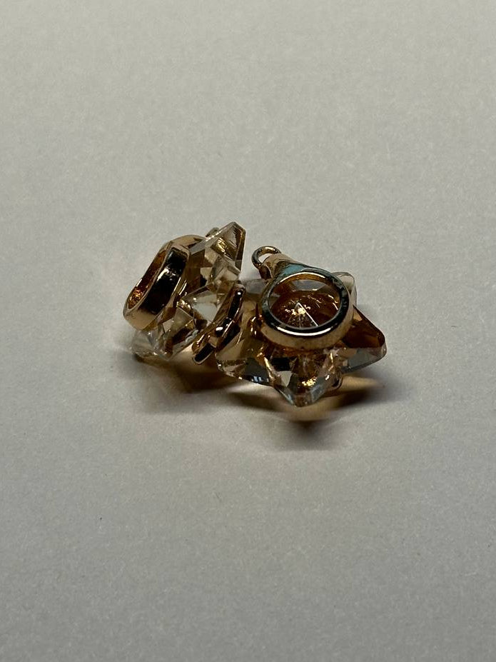 Pair of charms on a light gray background