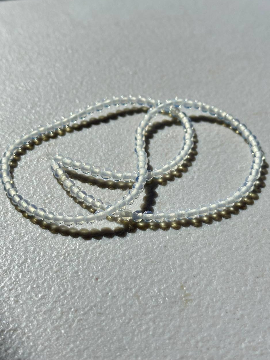 Opalite beads on white surface