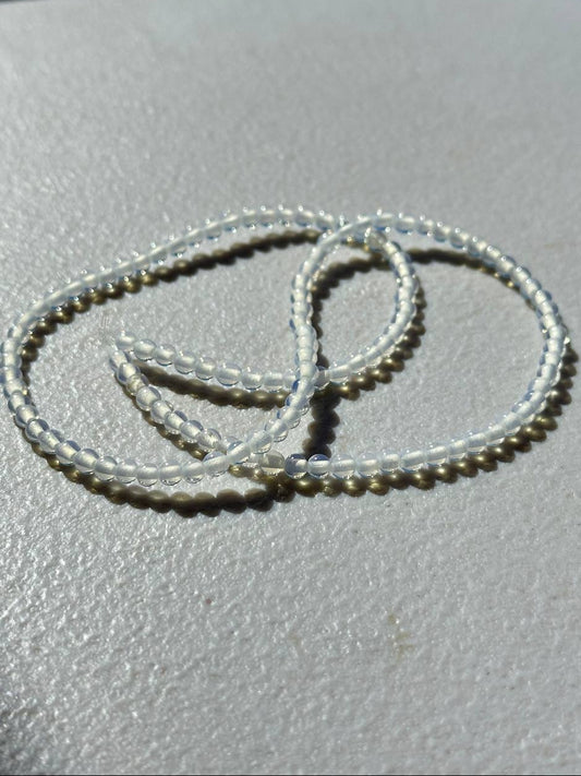 Opalite beads on white surface