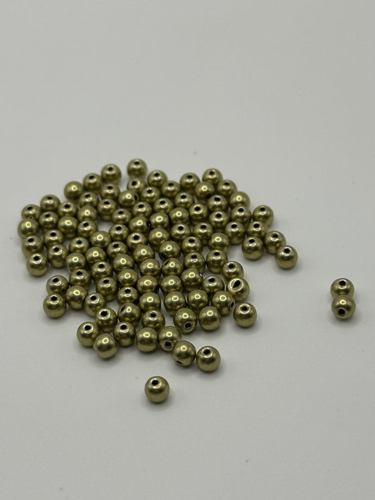 Bronze beads on a white background