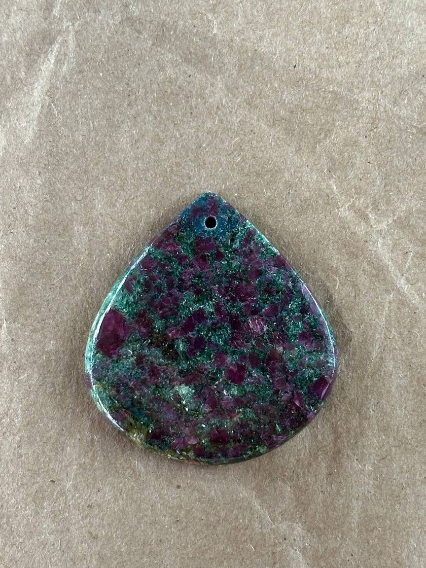 A wide teardrop shaped ruby fuchsite pendant
