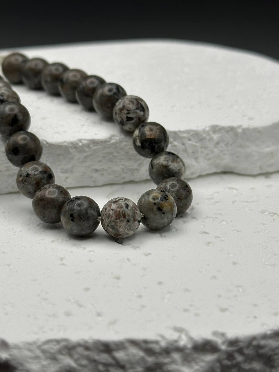 Yooperlite beads on white surface
