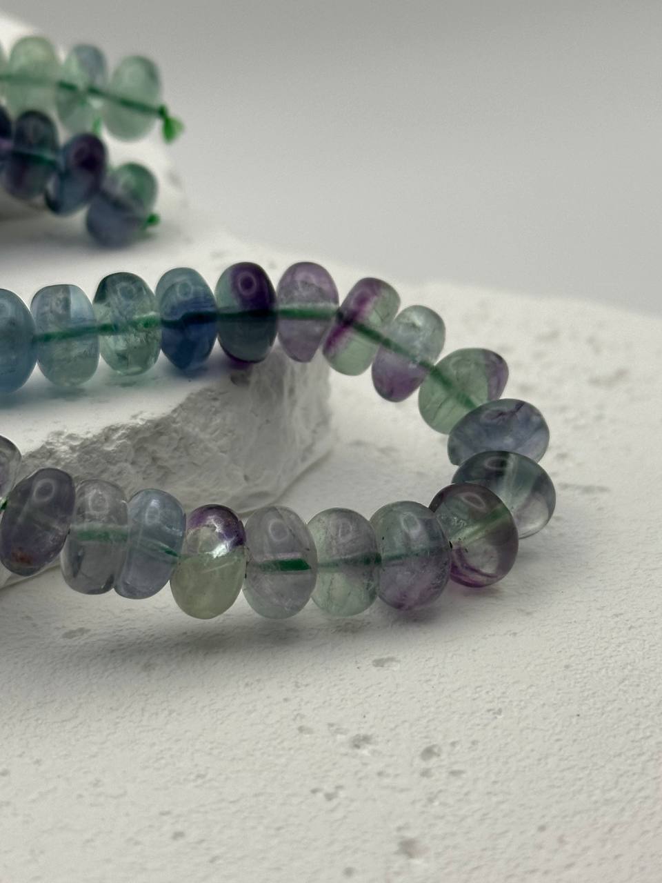 Multicolored beaded bracelet on a light surface