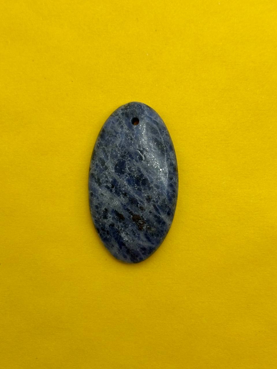 Blue oval stone pendant on a yellow background