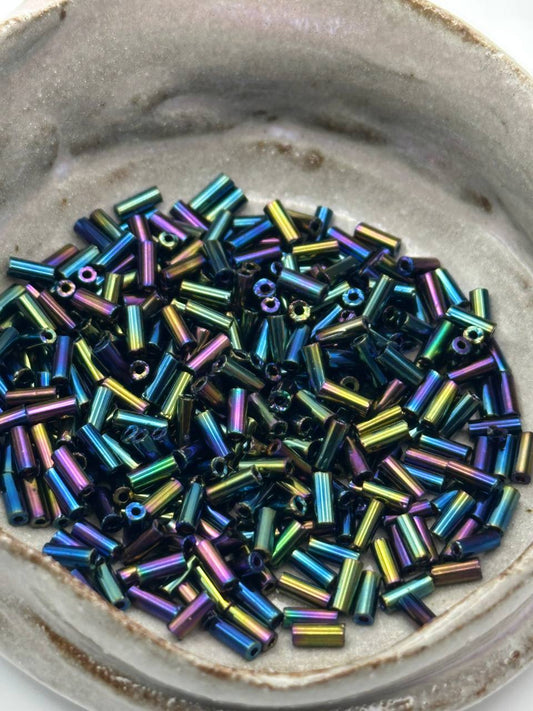 Colorful beads in a ceramic dish