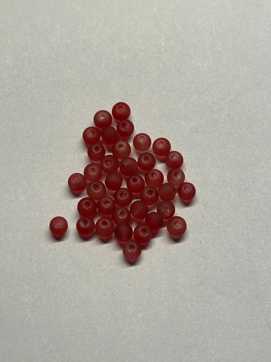 Red beads on a light gray background