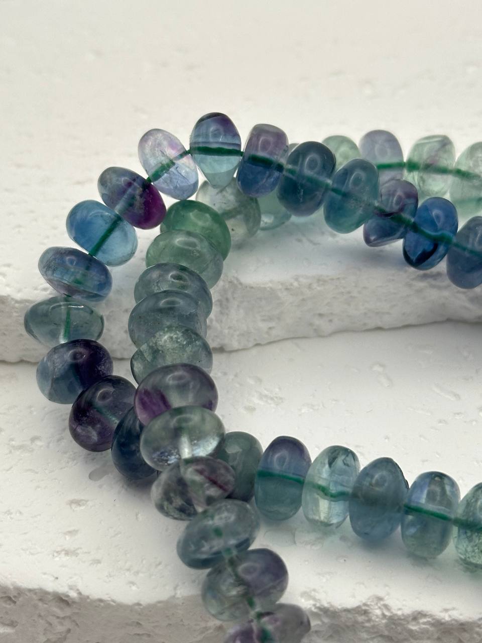 Multicolored beaded bracelet on a white surface