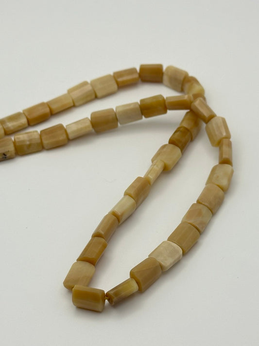 calcite rectangle beads on white surface