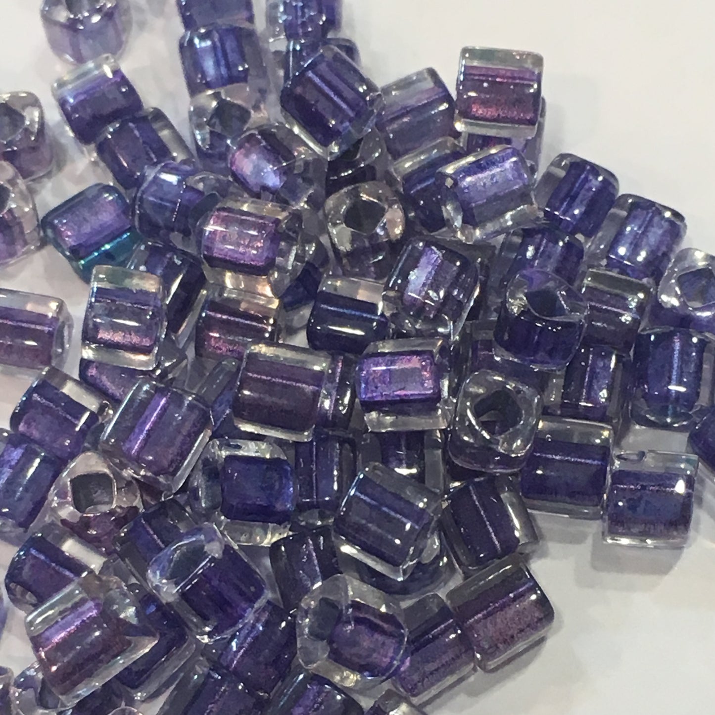 TOHO T4C265 4 mm Cube / Square Bead Metallic Purple Lined Crystal Rainbow, 5 gm