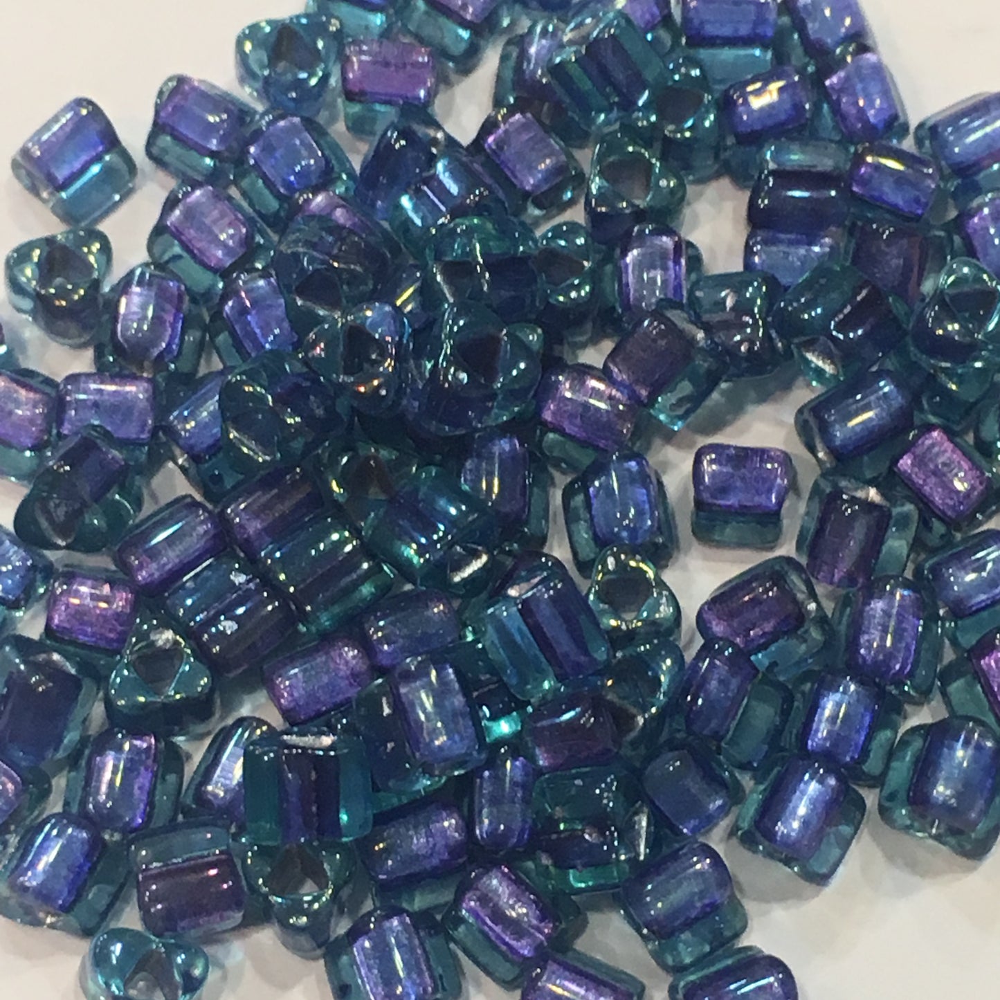 TOHO  4 mm Metallic Purple Lined Capri Blue Glass Triangle Beads, 5 gm