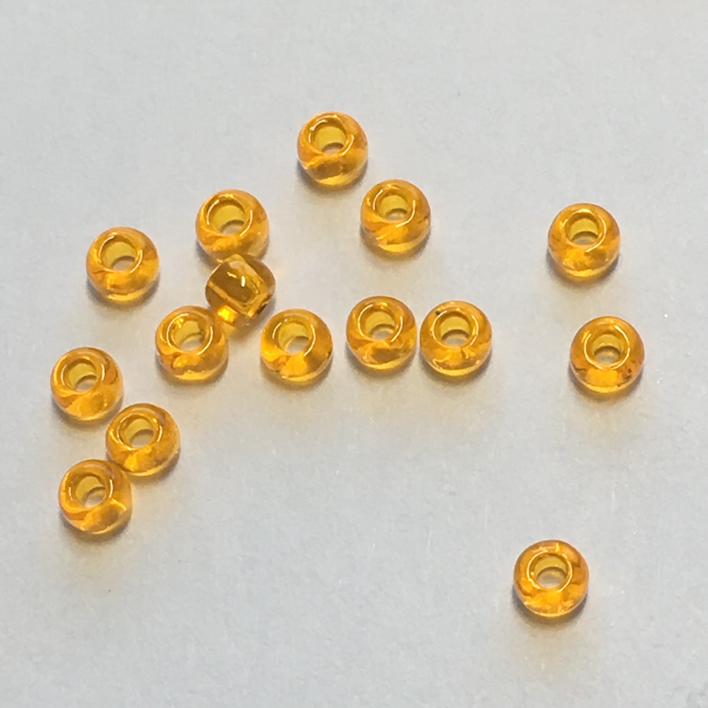 TOHO TR-11-10  11/0 Transparent Hyacinth Seed Beads, 5 gm