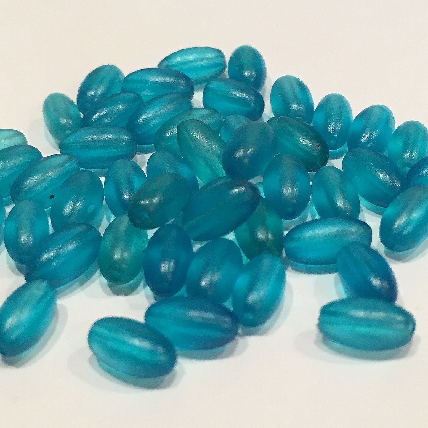 Translucent Blue Acrylic Oval Beads, 7 x 4 mm, 46 Beads
