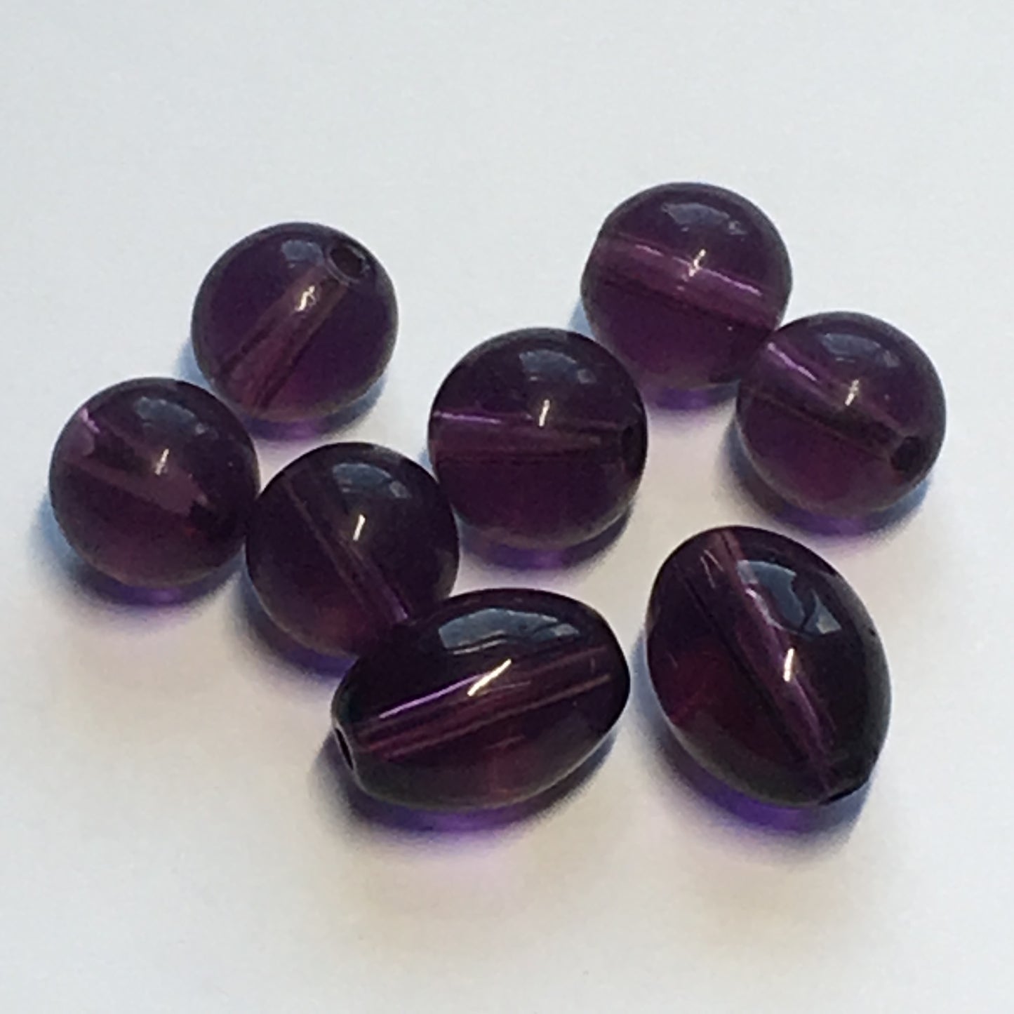 Transparent Dark Purple Round and Oval Glass Beads, 11 x 8  and 8 mm, 8 Beads