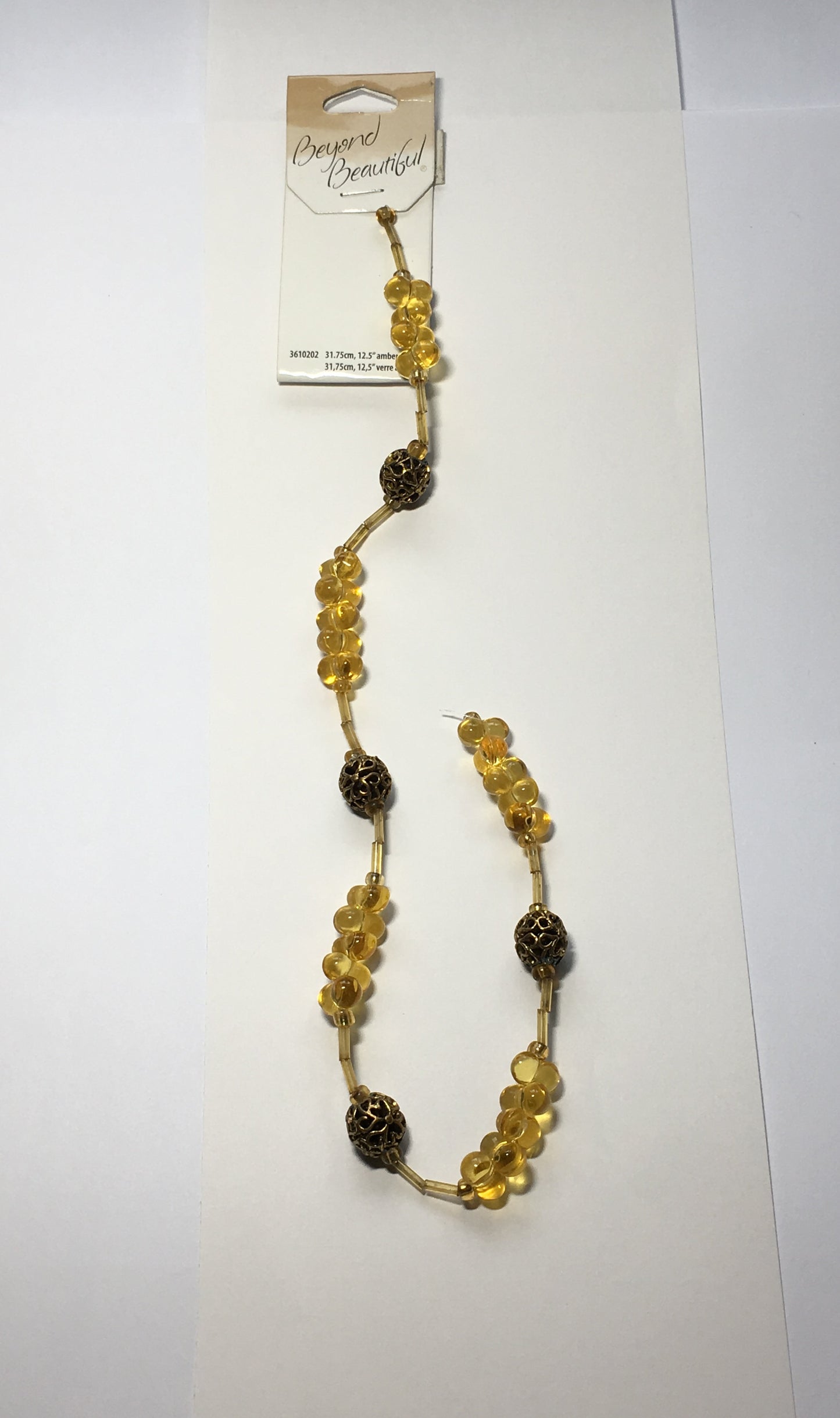 Beyond Beautiful Amber Glass 10 x 6 mm Farfalle Beads (25) with Gold Filigree Heart Design 10 mm (4) Gold Metal Beads
